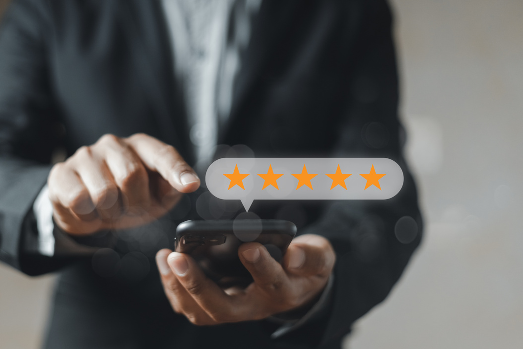 Star icon satisfaction survey, businessman finger to smartphone with five star icons, ranking of business. feedback, rating, survey, positive.